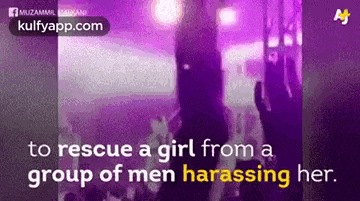a woman is being harassed by a group of men in a purple room .