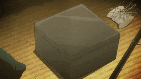 a drawing of a box with a spool of thread on it