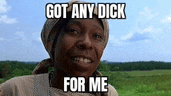 a woman in a field with the words got any dick for me written on her face .
