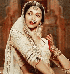 a woman with a nose ring and a veil on her head