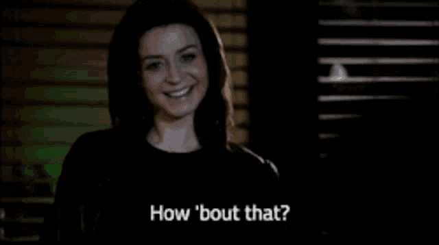 a woman in a black shirt is asking how ' bout that '