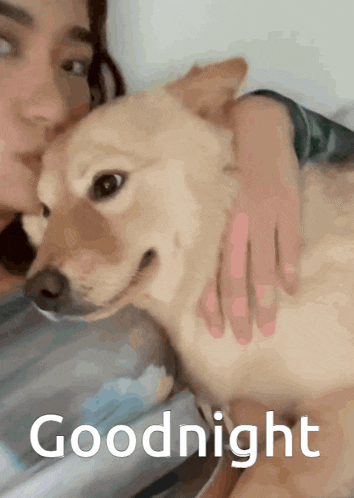 a woman kissing a dog with the words goodnight written below