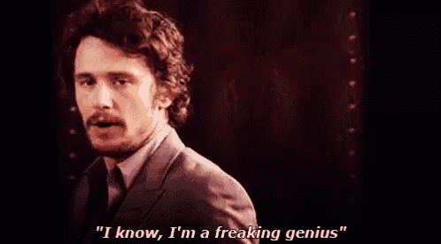 a man in a suit and tie says i know , i 'm a freaking genius .