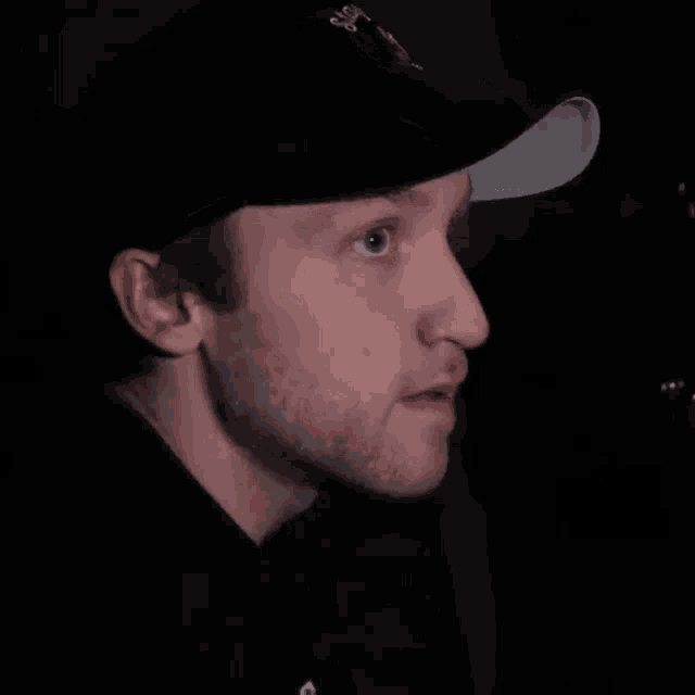 a man wearing a hat that says angry bird on it