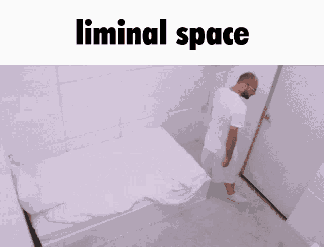 a man is standing in a room with a bed and the words liminal space above him