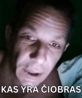 a close up of a man 's face with the words kas yra ciobras written below him
