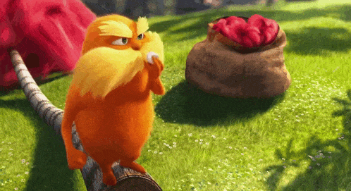 a cartoon character with a beard and mustache is standing on a log in the grass .