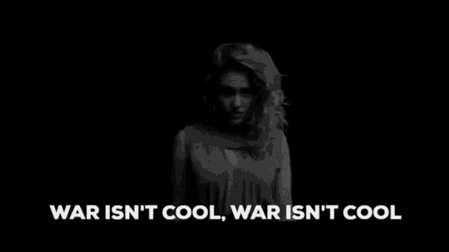 a black and white photo of a woman with her hands on her head with the words `` war is only bad and it makes me sad '' .