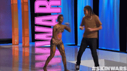 a man and a woman are dancing in front of the word skin wars