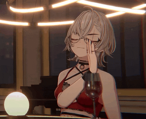 a girl with glasses holds a glass of wine