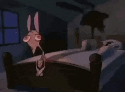 a cartoon rabbit is standing on a bed in a dark room