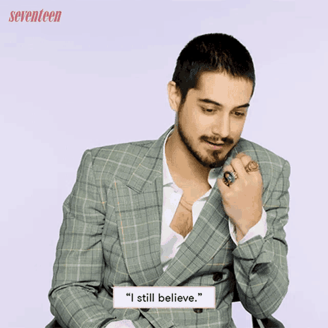 a man in a suit says " i still believe " while wearing rings