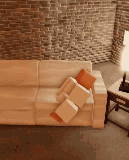 a white couch with orange pillows on it