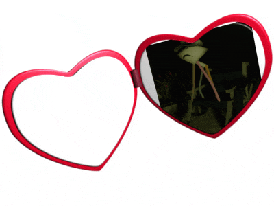 a pair of heart shaped sunglasses with a reflection of a flamingo in the mirror