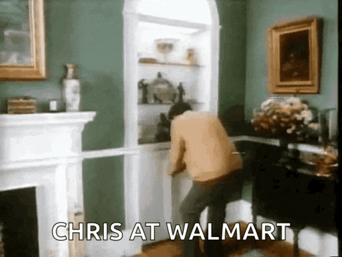 a man is standing in a living room with the words " chris at walmart " on the bottom