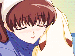 a girl with a bandage on her head is laying down