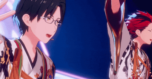 a couple of anime characters are standing next to each other on a stage .