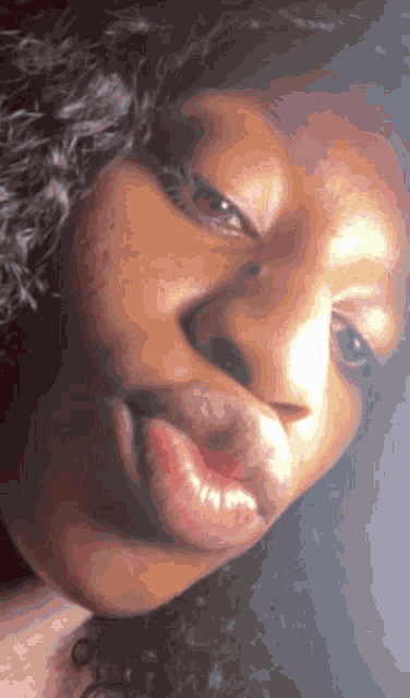 a close up of a woman 's face with her lips visible