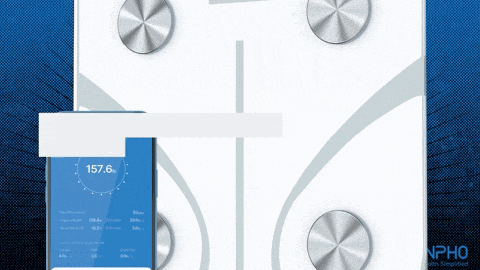 a phone displays a weight of 157.6 pounds on a scale