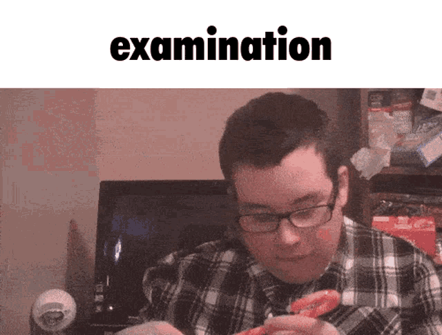 a man in a plaid shirt is eating a donut in front of the word examination