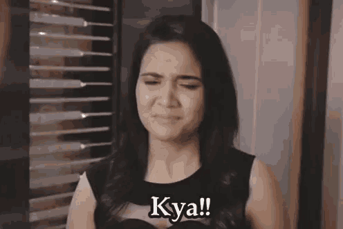 a woman making a funny face with the words kya written on her chest