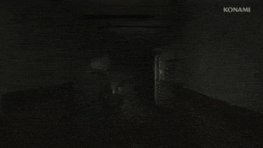 a man holding a gun in a dark hallway with konami on the bottom right