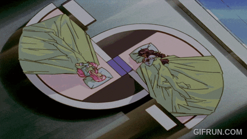 a gif from gifrun.com shows two women sleeping on a bed