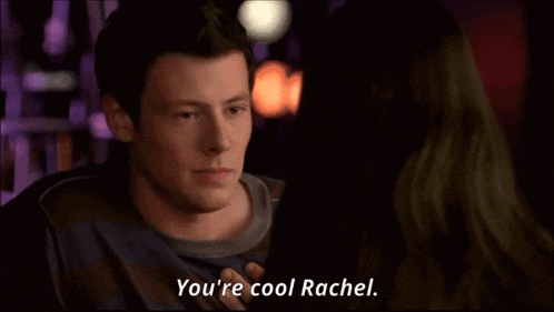 a man and a woman are looking at each other and the man says you 're cool rachel
