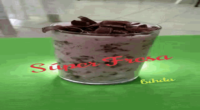 a glass of super fresa sits on a table