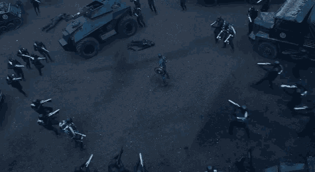 a group of soldiers are standing in a circle with their arms outstretched in front of a military vehicle