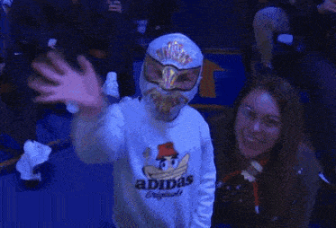 a wrestling match is being held in a ring with a banner that says roshfiv