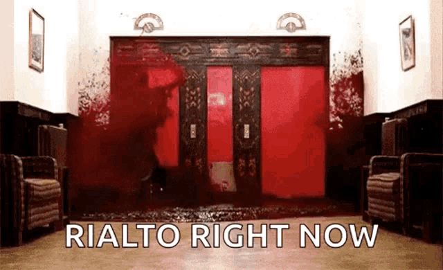 a bloody elevator with the words rialto right now written on it .