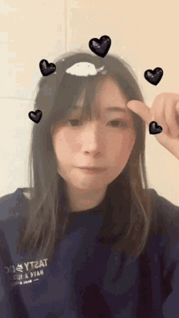 a girl wearing a blue sweatshirt that says yt2at