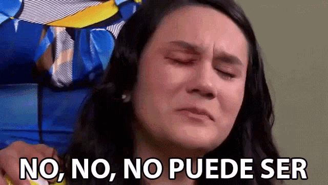 a woman is crying with the words no , no , no puede ser below her