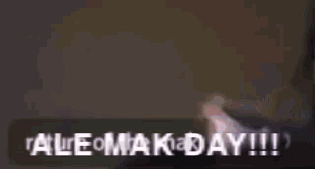 a close up of a person 's face with the words `` ale omaka day !!! '' written in white letters .