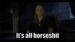 a man with long hair is sitting in a chair and says it 's all horseshit .