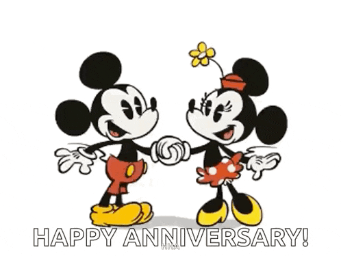 mickey mouse and minnie mouse are kissing and holding hands in a happy anniversary greeting card .