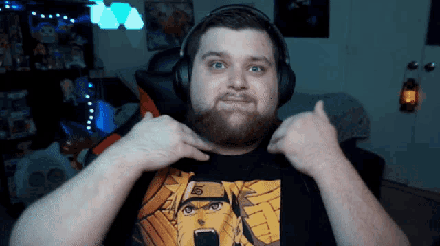 a man with a beard is wearing a naruto shirt