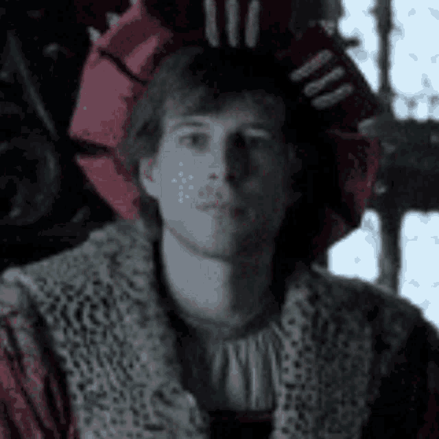 a man wearing a fur coat and a red hat