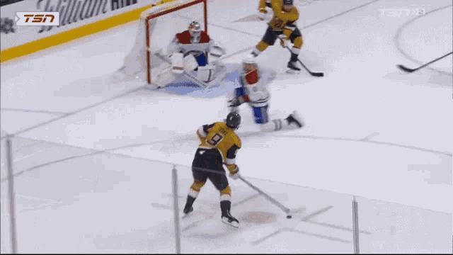 a hockey game is being played in front of a sign that says william hill