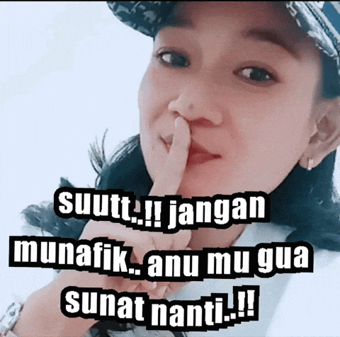 a woman is making a shhh sign with her finger
