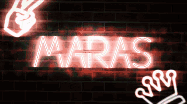 a neon sign that says maras on a red brick wall