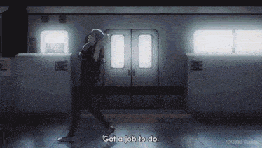 a man walking in front of a train with the words " got a job to do "