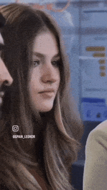 a close up of a woman 's face with spain_leonor written on the bottom right