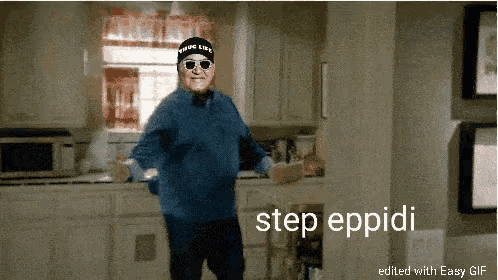a man wearing sunglasses and a hat that says " true life " is dancing in a kitchen