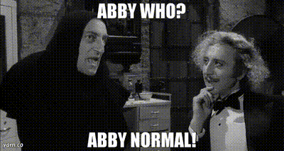 a black and white photo of two men with the caption abby who