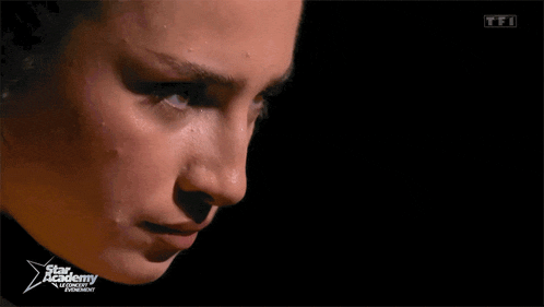 a close up of a woman 's face with the words star academy on the bottom right