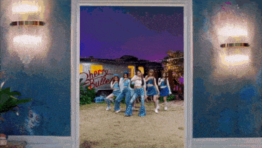 a group of young women are dancing in front of a trailer that says cherry butter