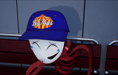 a blue hat that says big taps sits on a red bench