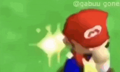 a blurred image of a person wearing a red hat with a g on it